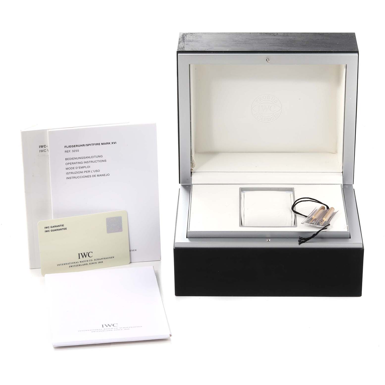 This image shows the box, guarantee card, and manuals for an IWC Pilot IW325504 Men's Stainless Steel Black Dial IW325504 Men's Stainless Steel Black Dial model watch.