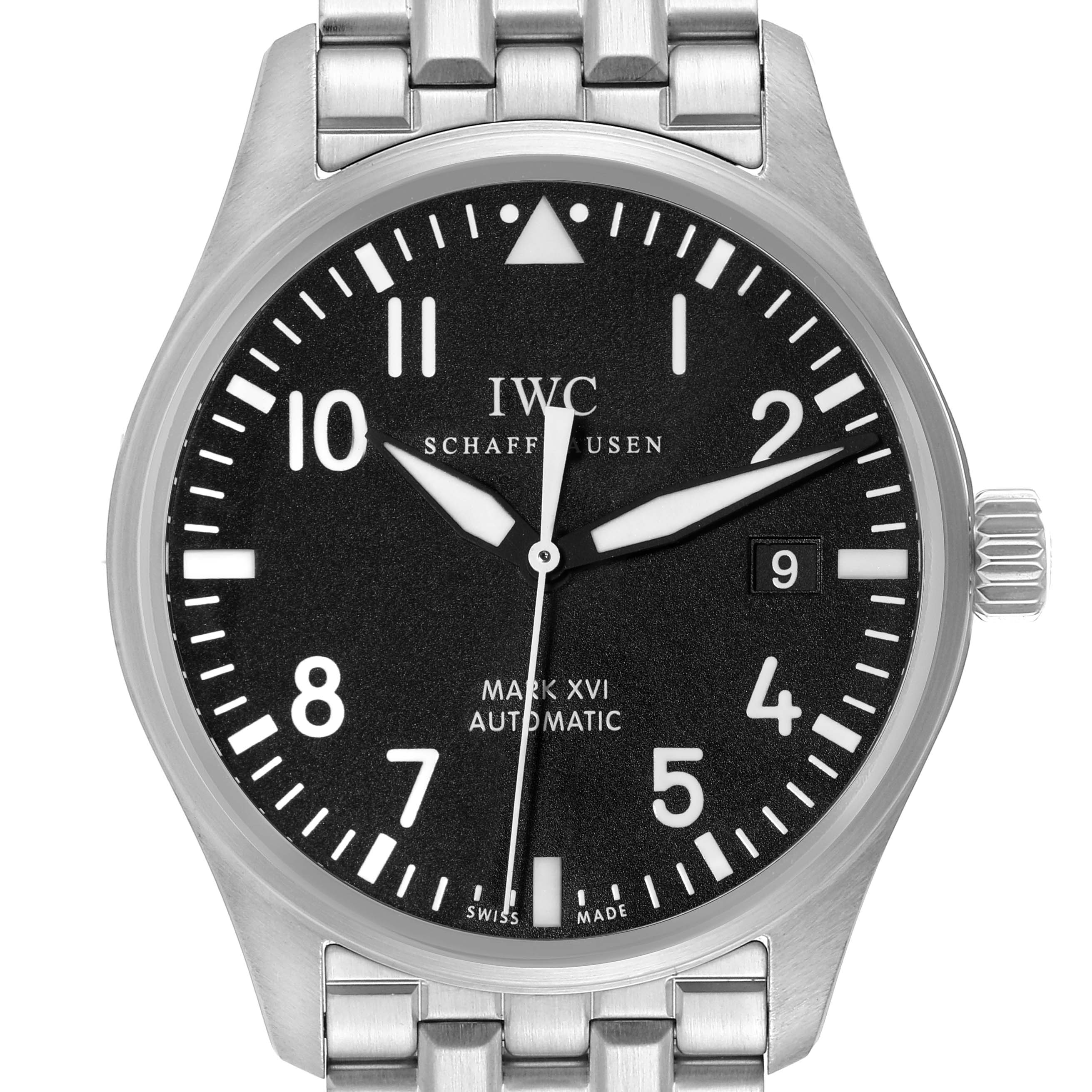 The image shows a frontal view of the Pilot model by IWC, displaying the dial, hands, date window, and a portion of the metal bracelet.