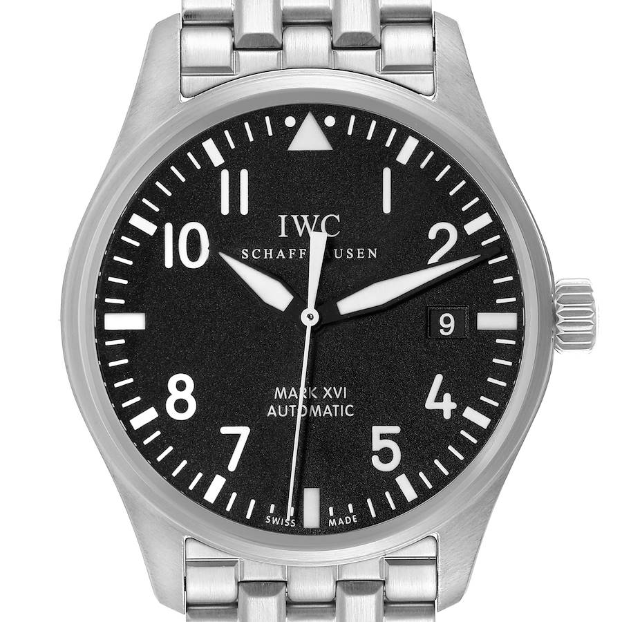 The image shows a frontal view of the Pilot model by IWC, displaying the dial, hands, date window, and a portion of the metal bracelet.