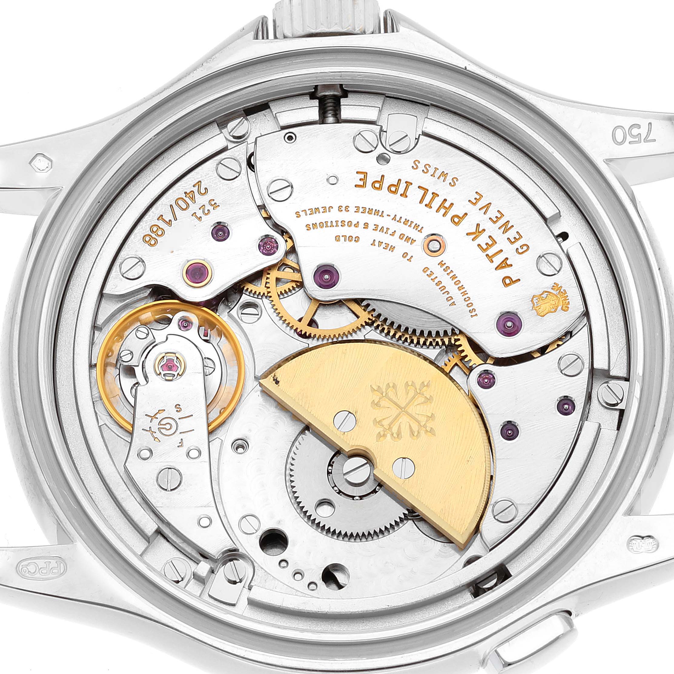 This close-up view shows the intricate movement and mechanisms of the Patek Philippe Complications 5110G Men's White Gold Silver Dial 5110G Men's White Gold Silver Dial watch model.