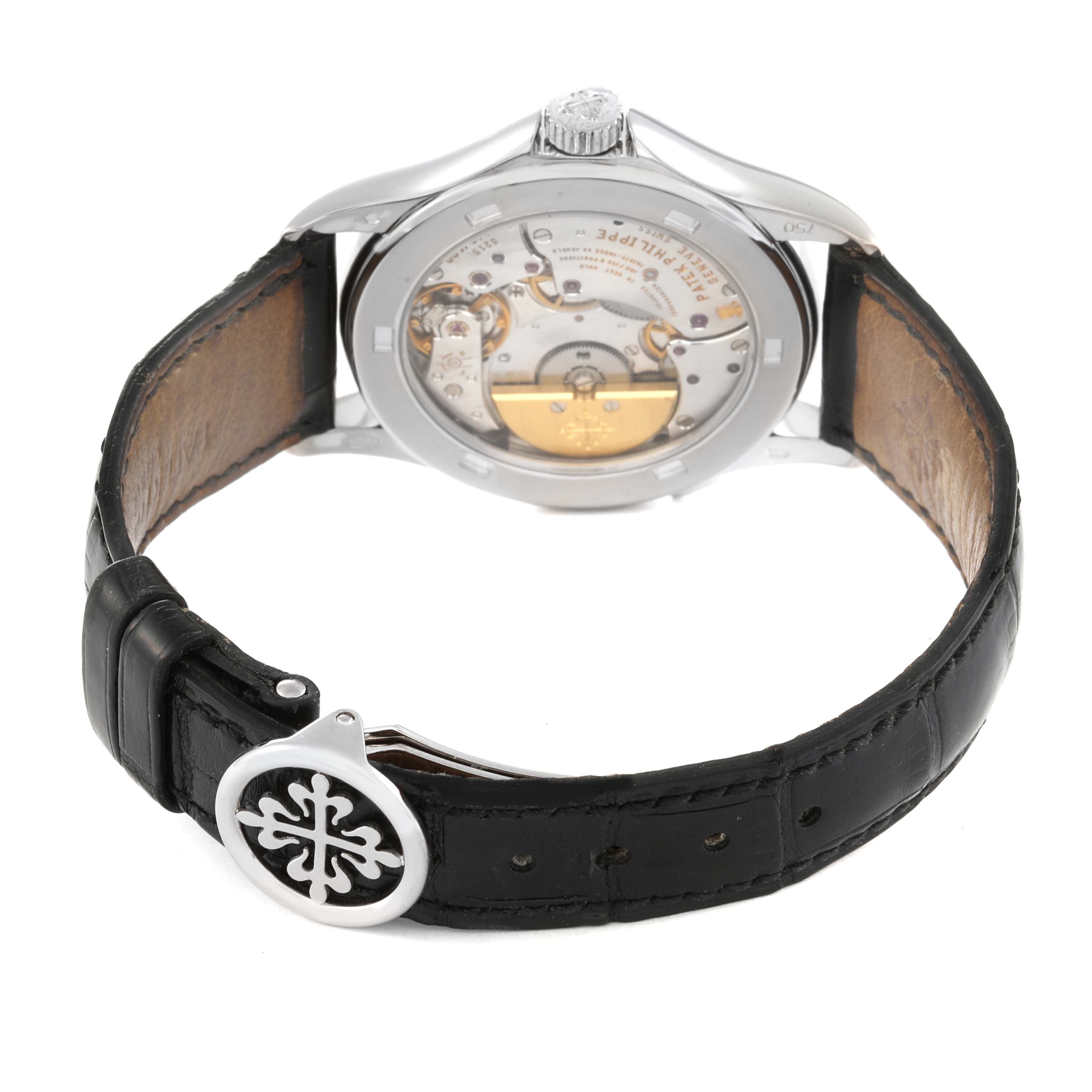 The image shows a Patek Philippe Complications 5110G Men's White Gold Silver Dial 5110G Men's White Gold Silver Dial model watch from the rear, highlighting the movement and leather strap with clasp.