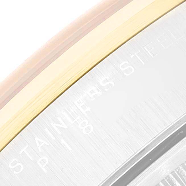 This is a close-up of the side and bezel of a Rolex Date 15203 Men's Steel and Gold (two tone) White Dial 15203 Men's Steel and Gold (two tone) White Dial model, showcasing the stainless steel and gold tones.