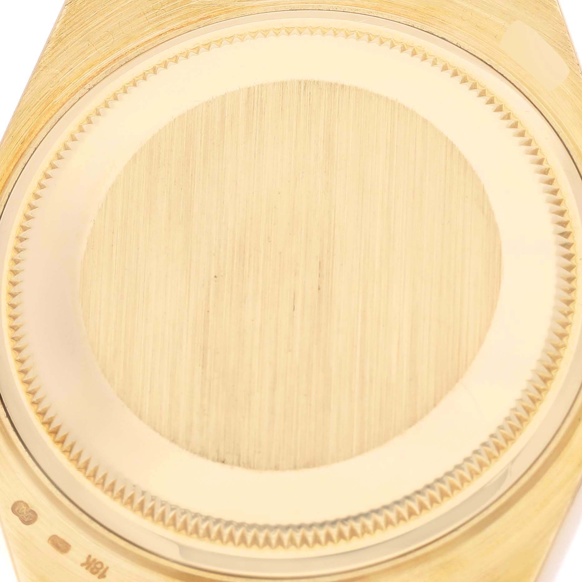 The image shows a close-up of the caseback of a Rolex Oysterquartz 19018 Men's Yellow Gold Champagne Dial 19018 Men's Yellow Gold Champagne Dial watch.