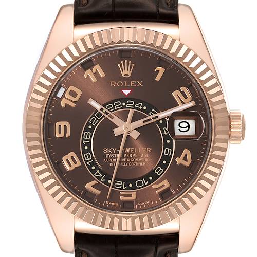 The image shows a frontal close-up of a Rolex Sky-Dweller 326135 Men's Rose Gold Brown Dial 326135 Men's Rose Gold Brown Dial watch with a brown dial and date display.