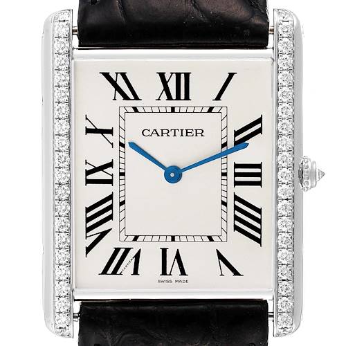 The Cartier Tank Louis WT200006 Men's White Gold Silver Dial watch is shown from the front, displaying its diamond bezel, blue hands, and Roman numeral dial.