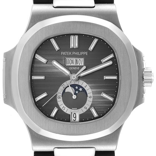 The image shows the front view of the Patek Philippe Nautilus 5726A-001 Men's Stainless Steel Black Dial 5726A-001 Men's Stainless Steel Black Dial watch, highlighting its dial, hands, crown, and moon phase indicator.