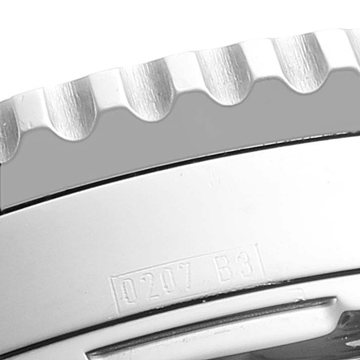 Close-up of the Breitling Navitimer A23322 Men's Stainless Steel Black Dial A23322 Men's Stainless Steel Black Dial watch bezel and case, showing engravings and part of the crown guard.