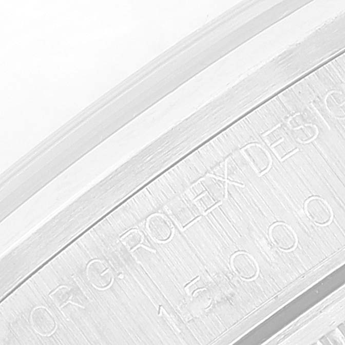 The image shows a close-up of the engraved serial number and text on the Rolex Date 15200 Men's Stainless Steel Black Dial 15200 Men's Stainless Steel Black Dial model watch casing.