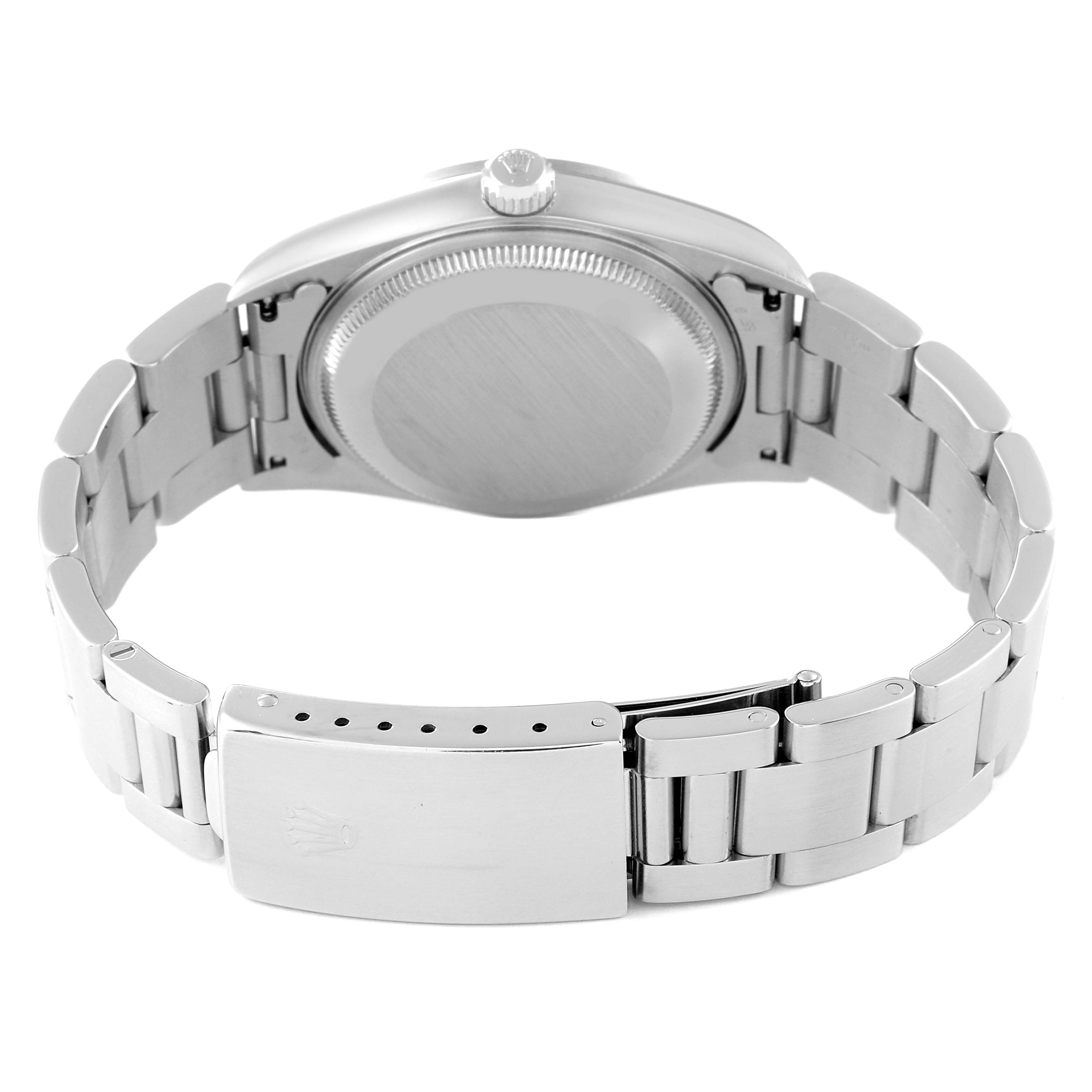 This image shows the back view of a Rolex Date 15200 Men's Stainless Steel Black Dial 15200 Men's Stainless Steel Black Dial model watch, focusing on the case back and the closed clasp of the bracelet.