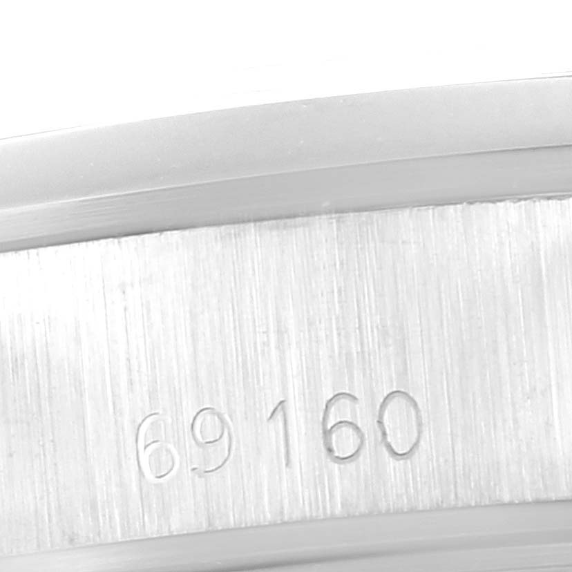The image shows a close-up of the case side with the model number "69160" of a Rolex Date 69160 Women's Stainless Steel Blue Dial 69160 Women's Stainless Steel Blue Dial watch.
