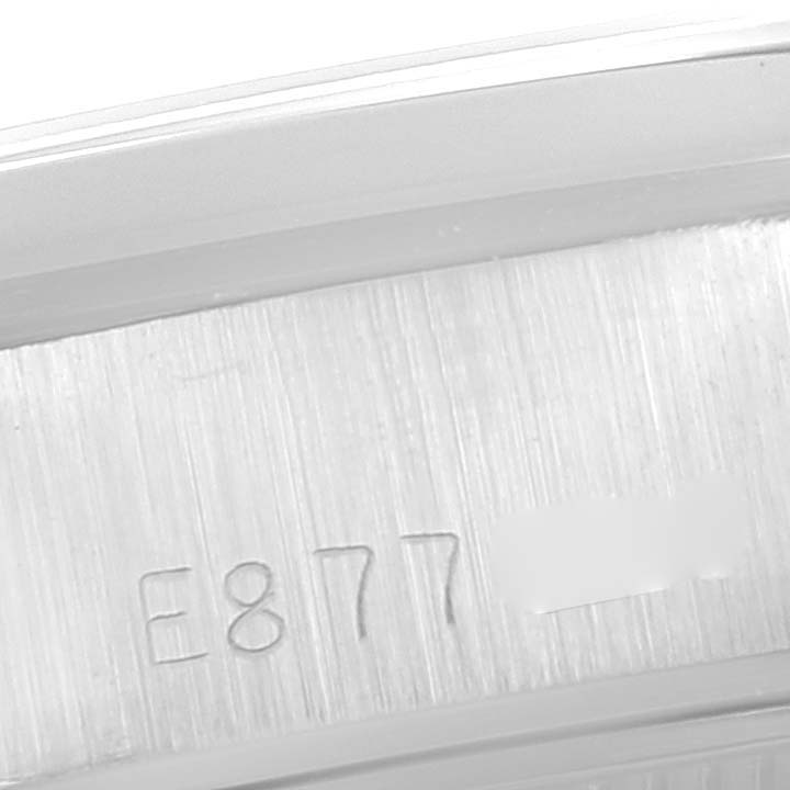 This is a close-up view of the serial number engraved on the case of a Rolex Date 69160 Women's Stainless Steel Blue Dial 69160 Women's Stainless Steel Blue Dial model watch.