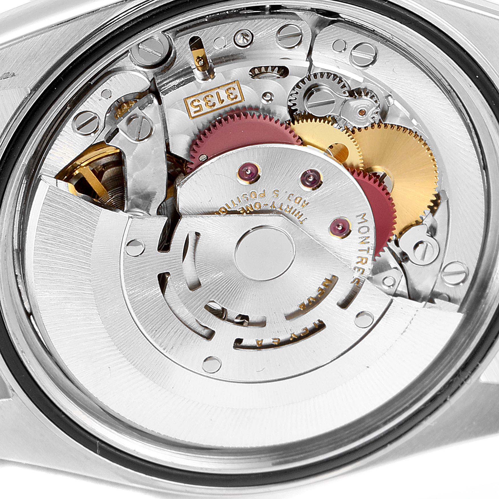 This image shows the inner mechanical movement of a Rolex Datejust 16233 Men's Steel and Gold (two tone) Mother of Pearl Dial 16233 Men's Steel and Gold (two tone) Mother of Pearl Dial watch, focusing on gears and intricate components.