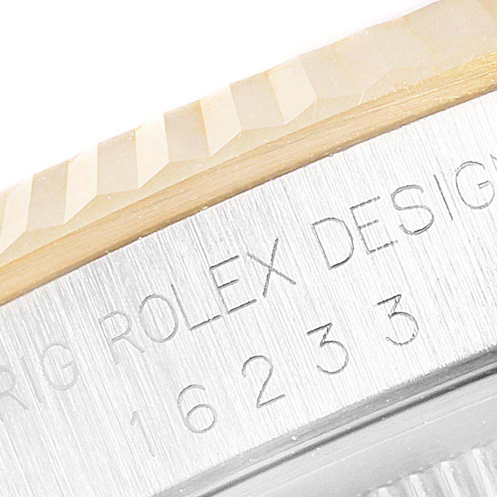 The image shows a close-up of the bezel and case, displaying "Rolex Design" and part of the serial number on a Rolex Datejust 16233 Men's Steel and Gold (two tone) Mother of Pearl Dial 16233 Men's Steel and Gold (two tone) Mother of Pearl Dial watch.