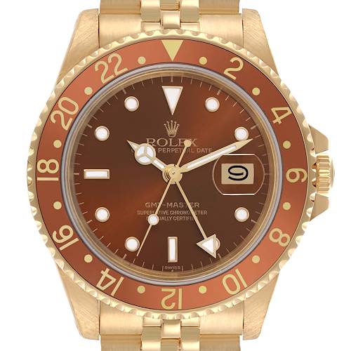 The Rolex GMT-Master 16758 Men's Yellow Gold Brown Dial 16758 Men's Yellow Gold Brown Dial watch is shown from the front, displaying the dial, bezel, and part of the bracelet.