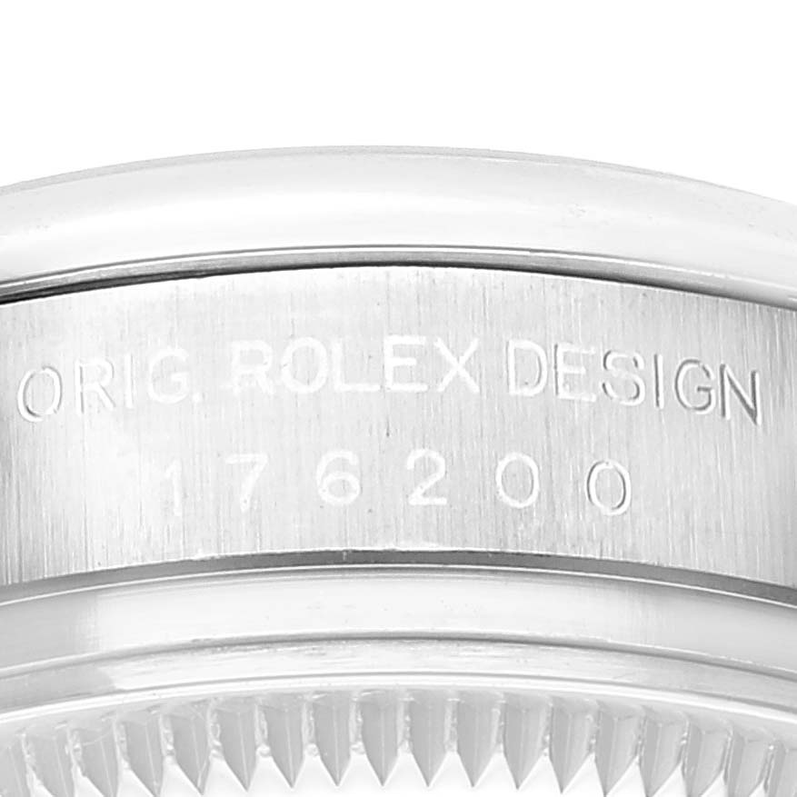 This image shows a close-up of the engraved side case of a Rolex Oyster Perpetual 176200 Women's Stainless Steel Silver Dial 176200 Women's Stainless Steel Silver Dial watch, highlighting the model number 176200.