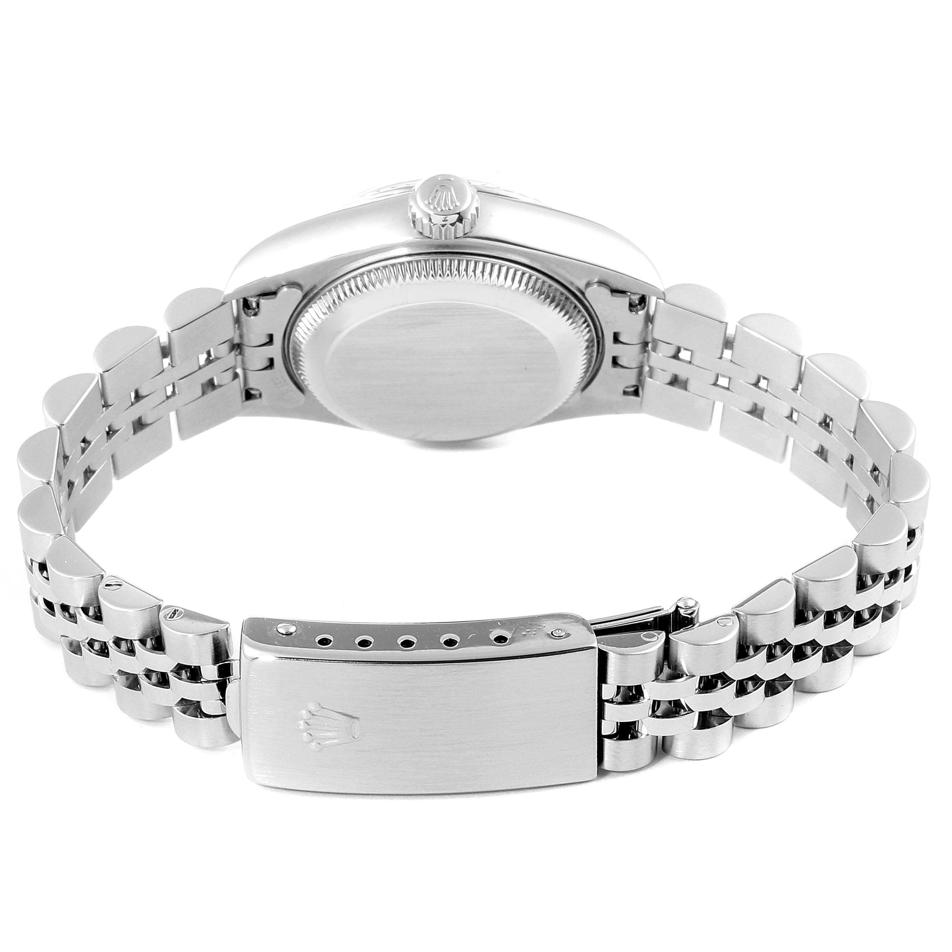 The image shows the back of the Rolex Datejust 69174 Women's Stainless Steel Pink Dial 69174 Women's Stainless Steel Pink Dial watch, focusing on the case, crown, and bracelet clasp.