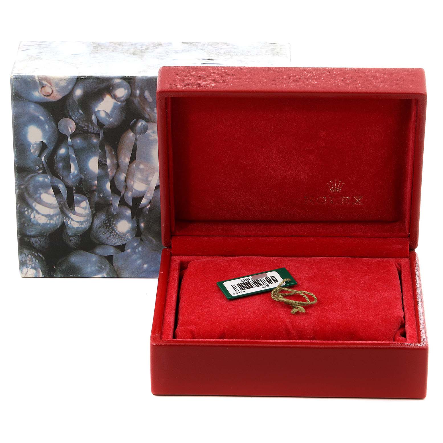 The image shows an empty red Rolex Datejust 69174 Women's Stainless Steel Pink Dial 69174 Women's Stainless Steel Pink Dial watch box with a pillow and hang tag, with the outer box in the background.