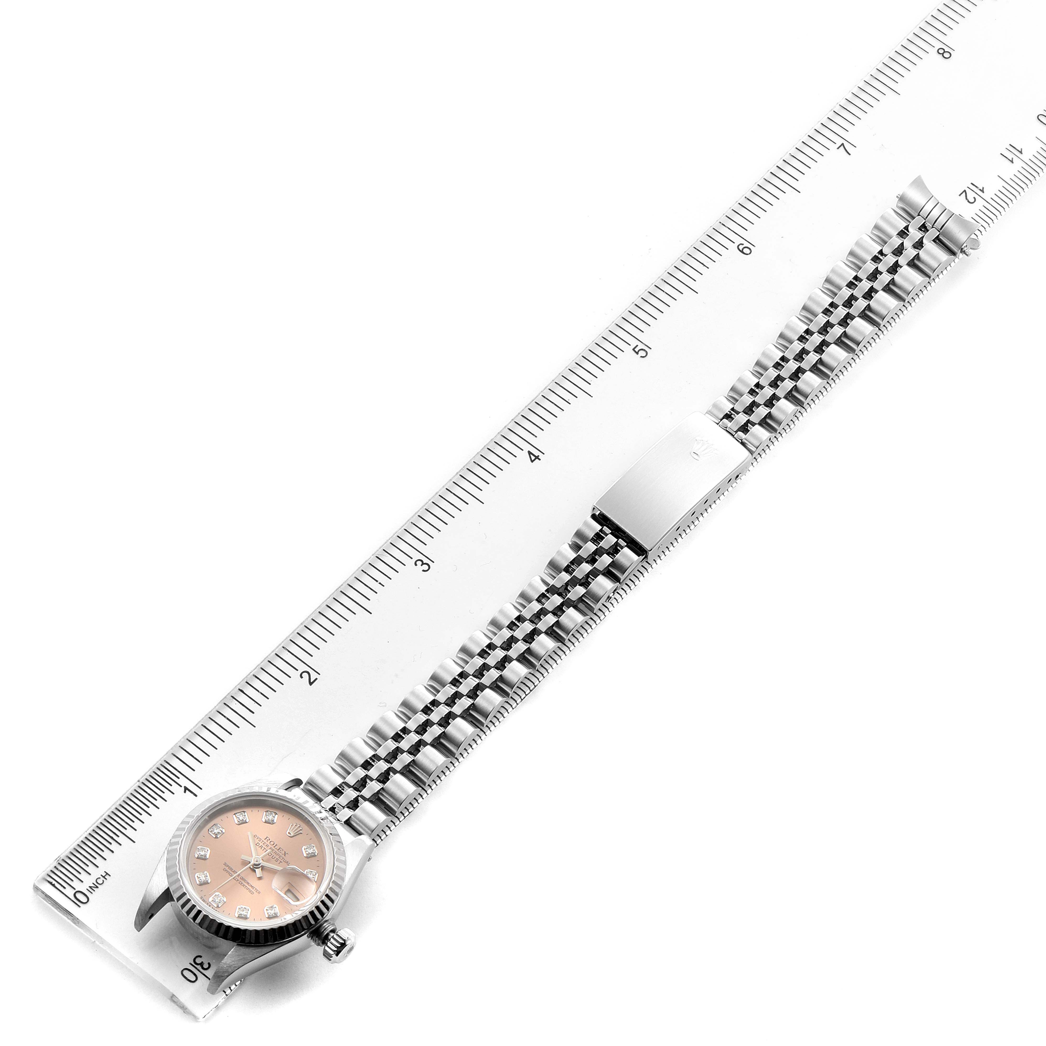 The Rolex Datejust 69174 Women's Stainless Steel Pink Dial 69174 Women's Stainless Steel Pink Dial watch is shown from a top-down angle, displaying its case, dial, crown, and complete bracelet.