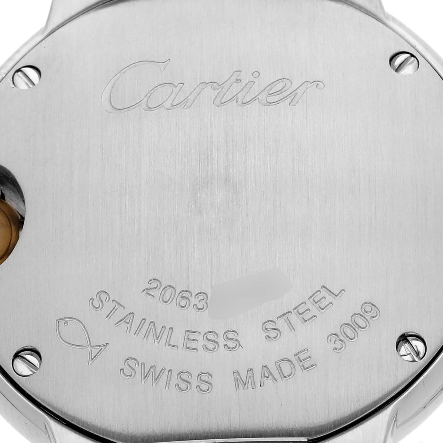 The image shows the stainless steel back of a Cartier Ballon Bleu W69007Z3 Women's Steel and Gold (two tone) Silver Dial W69007Z3 Women's Steel and Gold (two tone) Silver Dial watch with engraved details and screws.