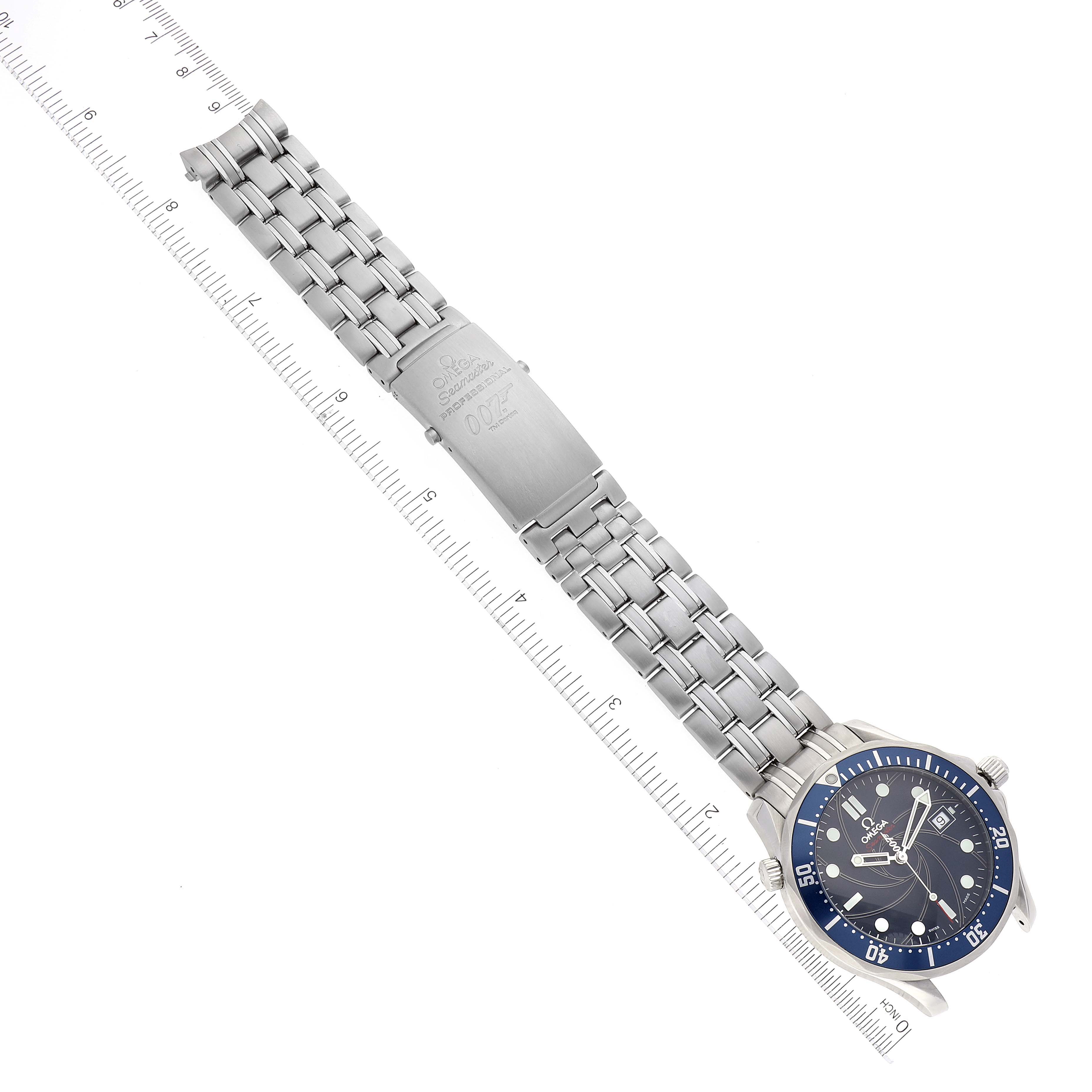 The Omega Seamaster 2226.80.00 Men's Stainless Steel Blue Dial 2226.80.00 Men's Stainless Steel Blue Dial watch is shown from an overhead view, displaying the face, bezel, bracelet, and clasp, with a ruler for scale.