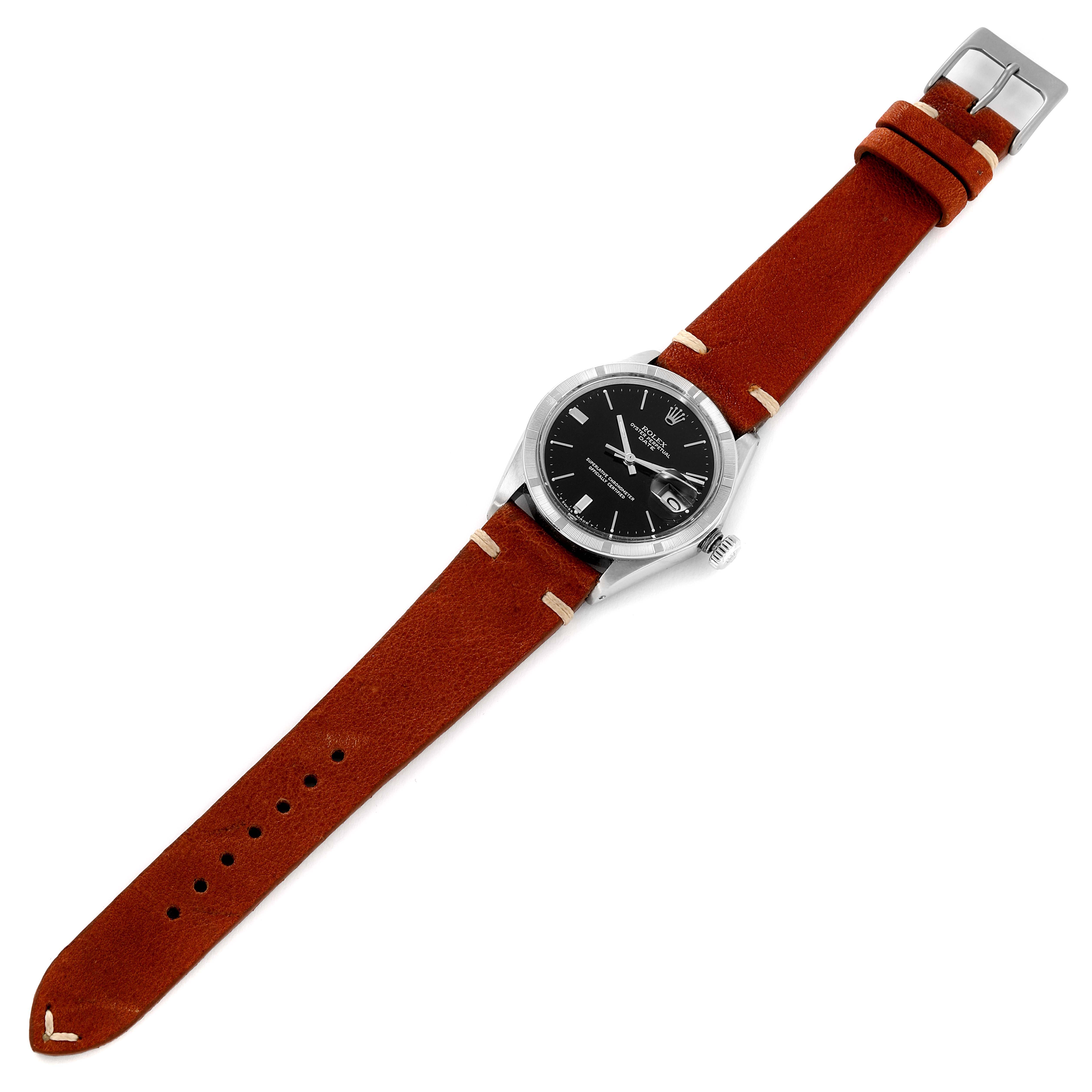 The image shows a top view of a Rolex Date 1501 Men's Stainless Steel Black Dial 1501 Men's Stainless Steel Black Dial model watch with a black dial and a brown leather strap.