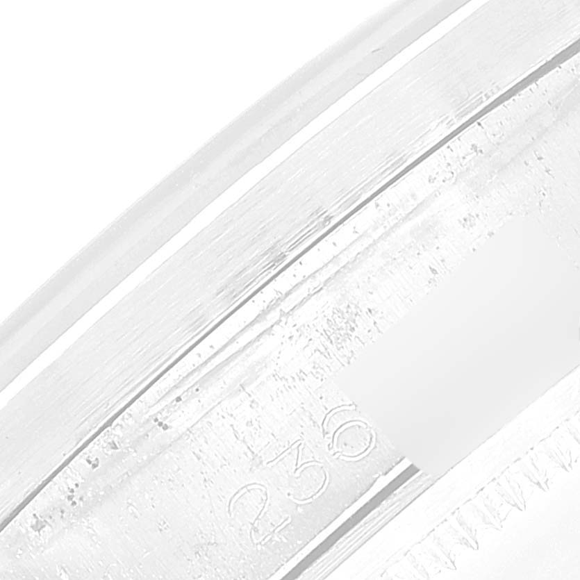This image shows a close-up of the side details and engraved markings on the bezel of a Rolex Date 1501 Men's Stainless Steel Black Dial 1501 Men's Stainless Steel Black Dial model.