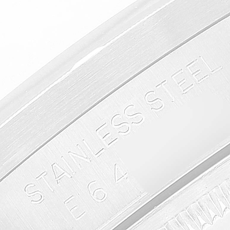 This image shows a close-up of the stainless steel engraving and part of the bezel on a Rolex Date 15210 Men's Stainless Steel White Dial 15210 Men's Stainless Steel White Dial model watch.
