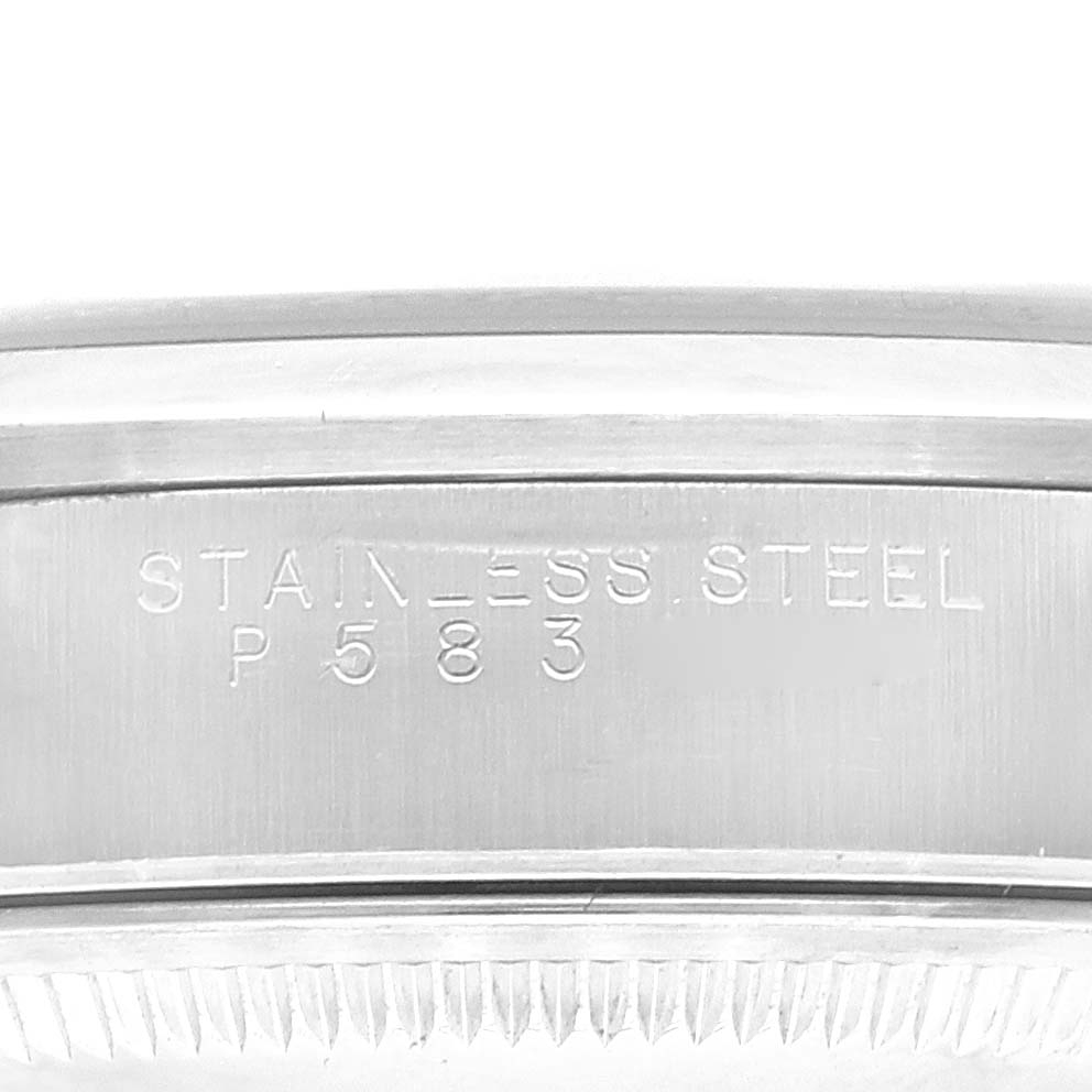 This image shows a close-up of the stainless steel side bezel and edge engraving of a Rolex Date 15200 Men's Stainless Steel Blue Dial 15200 Men's Stainless Steel Blue Dial model watch.