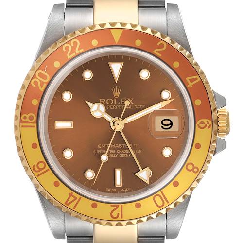 The Rolex GMT-Master 16713 Men's Steel and Gold (two tone) Brown Dial 16713 Men's Steel and Gold (two tone) Brown Dial watch is shown from a front angle, highlighting the bezel, dial, and date window.