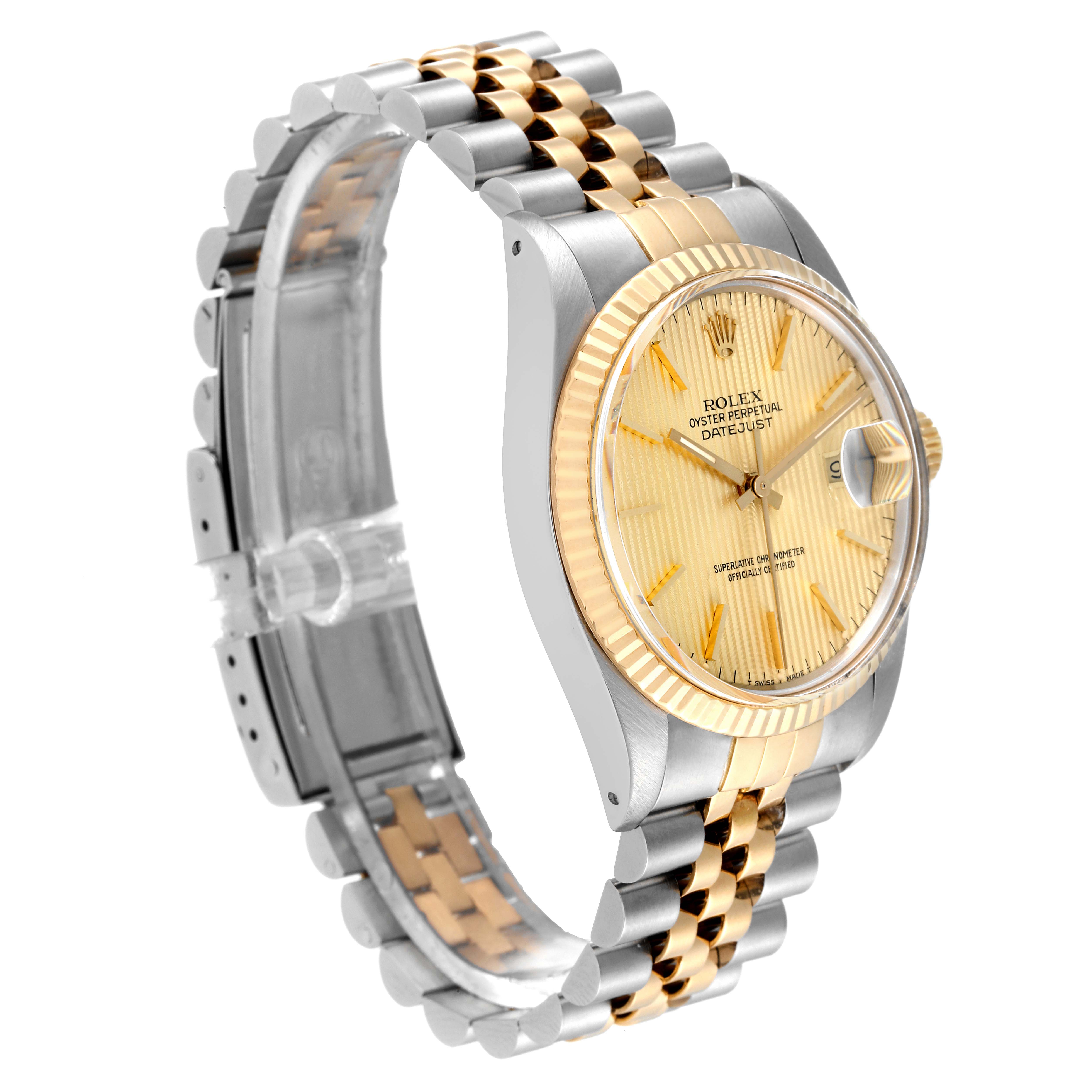 Side view of the Vintage Collection Rolex showing the gold and silver bracelet, bezel, and dial.