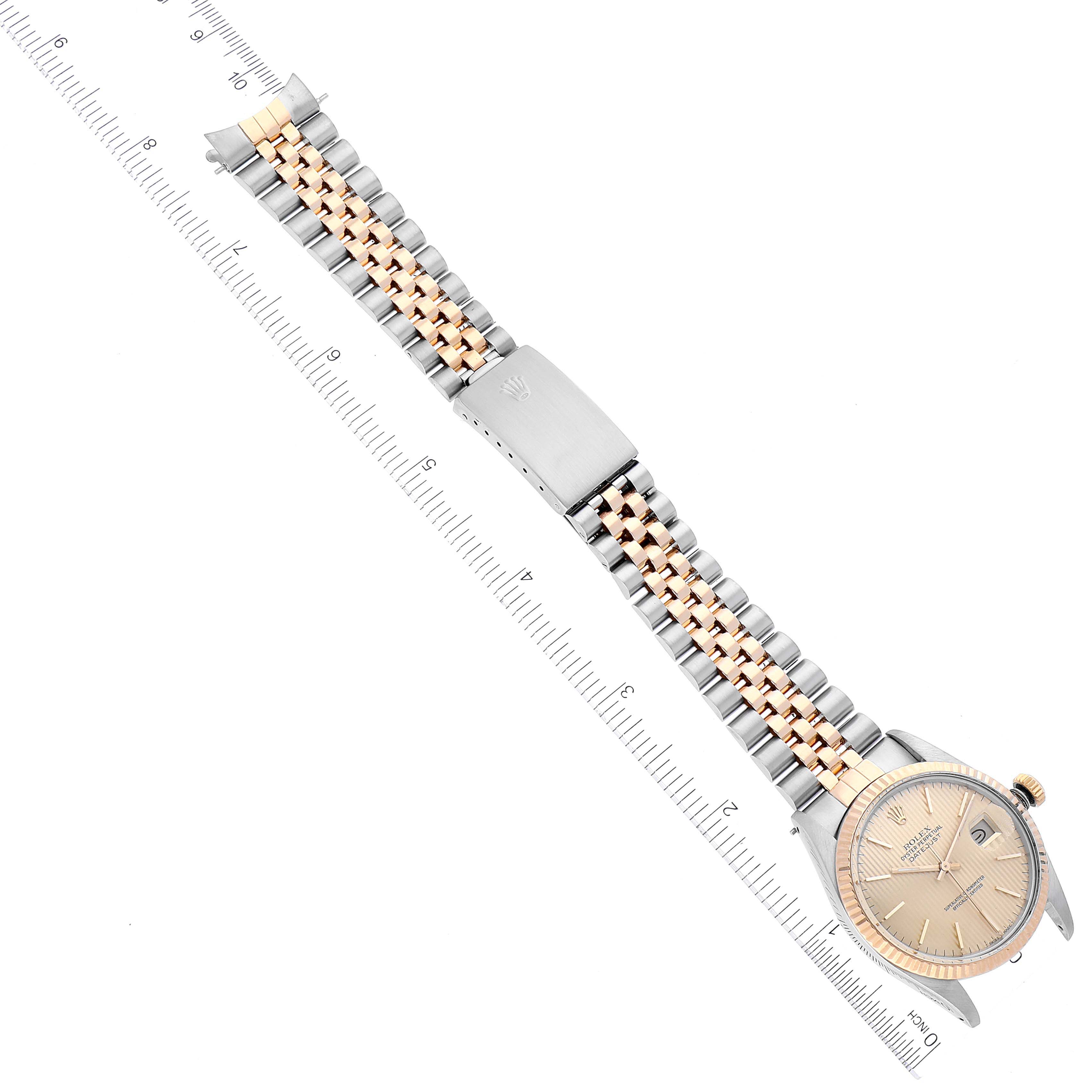 The image shows the Rolex Vintage Collection 16013 Men's Steel and Gold (two tone) Champagne Dial 16013 Men's Steel and Gold (two tone) Champagne Dial model watch laid flat, displaying the face, bracelet, and clasp at an angled top-down view.