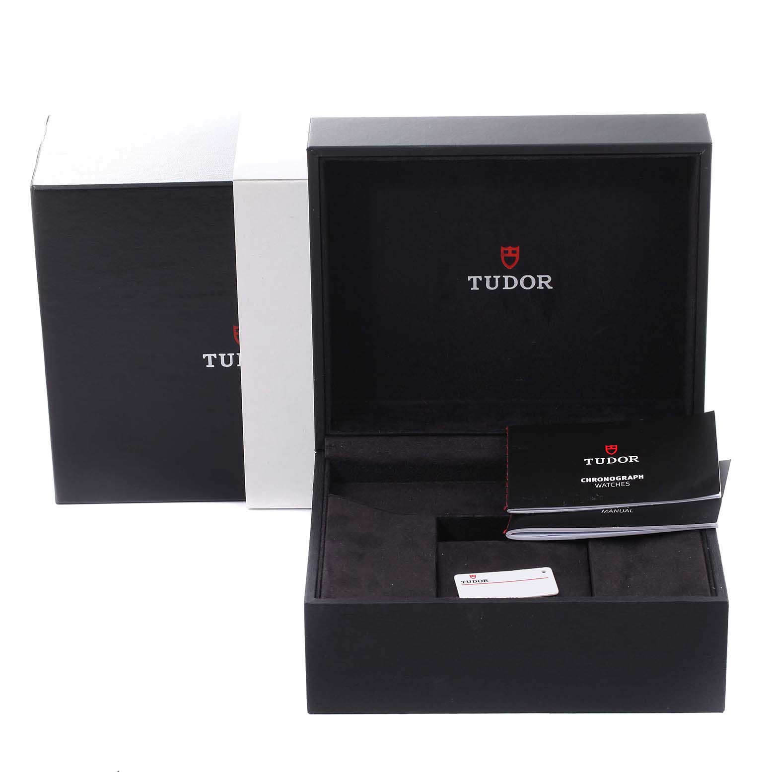 The image shows the open box of a Tudor Heritage Black Bay 79360N Men's Stainless Steel White Dial 79360N Men's Stainless Steel White Dial watch, featuring the manual and warranty card.