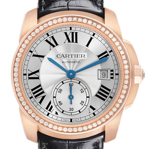 The Calibre de Cartier watch is shown from the front, highlighting its Roman numeral dial, sub-dial, and diamond-set bezel.