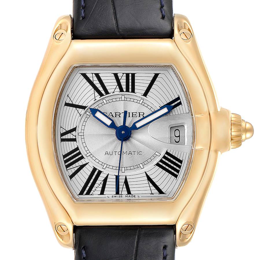 This image shows a Cartier Roadster W62005V2 Men's Yellow Gold Silver Dial W62005V2 Men's Yellow Gold Silver Dial watch face, crown, and part of the leather strap, viewed from the front.
