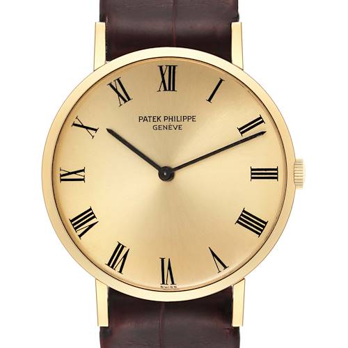 The image shows a frontal view of the Patek Philippe Calatrava 3537 Men's Yellow Gold Champagne Dial 3537 Men's Yellow Gold Champagne Dial watch, highlighting its dial, Roman numerals, and strap.