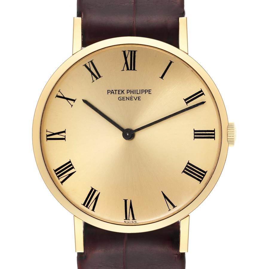 This image shows a front view of the Patek Philippe Calatrava 3537 Men's Yellow Gold Champagne Dial 3537 Men's Yellow Gold Champagne Dial wristwatch with a gold case and Roman numeral markers.