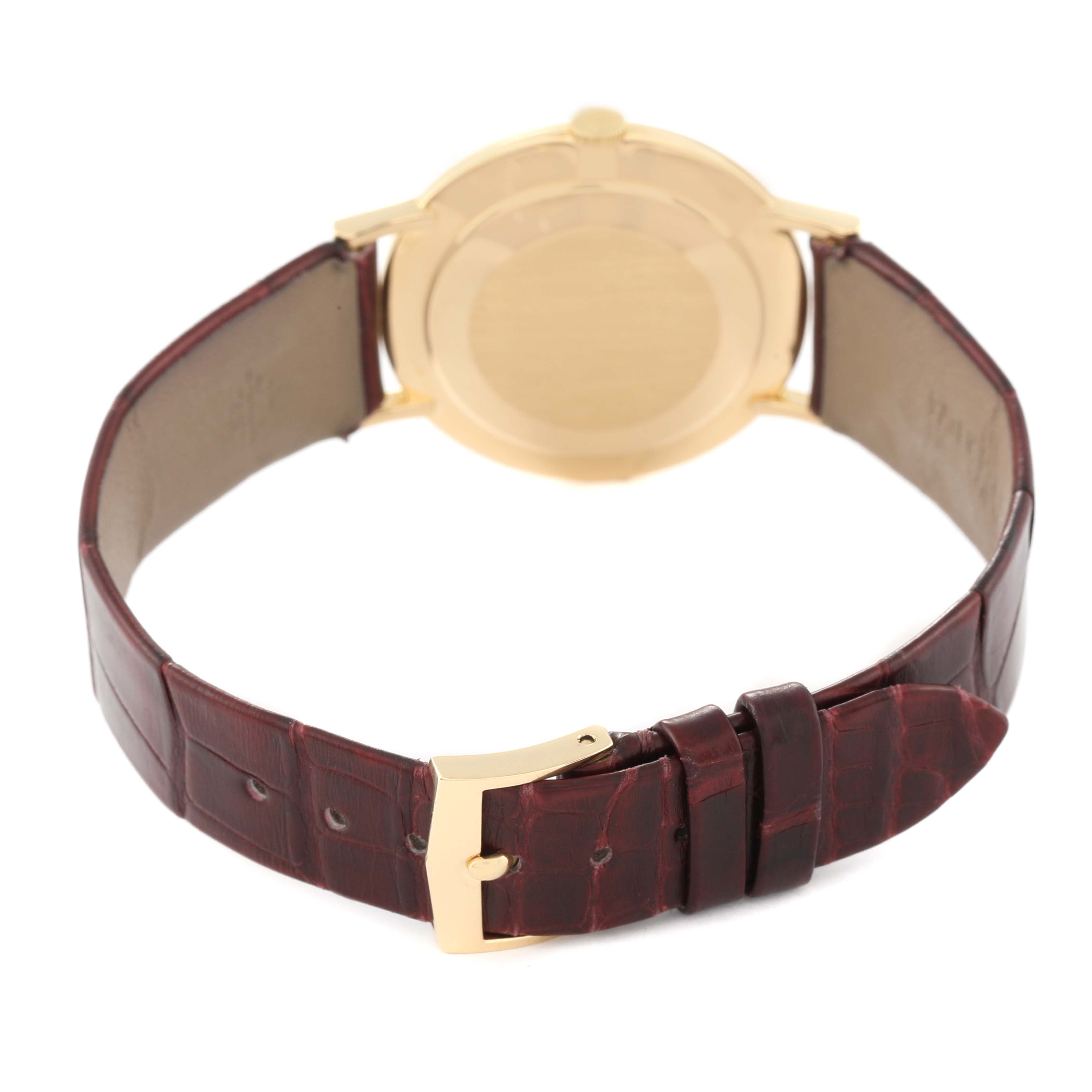 This image shows the back side and buckle of a Patek Philippe Calatrava 3537 Men's Yellow Gold Champagne Dial 3537 Men's Yellow Gold Champagne Dial watch with a leather strap.