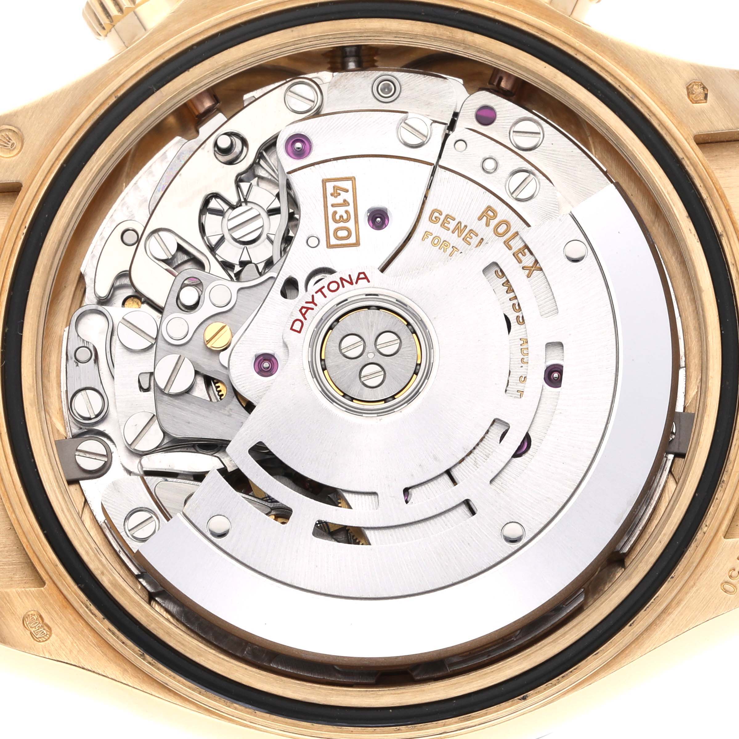 The image shows the rear view of a Rolex Daytona 116518 Men's Yellow Gold Black Dial 116518 Men's Yellow Gold Black Dial watch, highlighting its intricate movement and rotor mechanics.