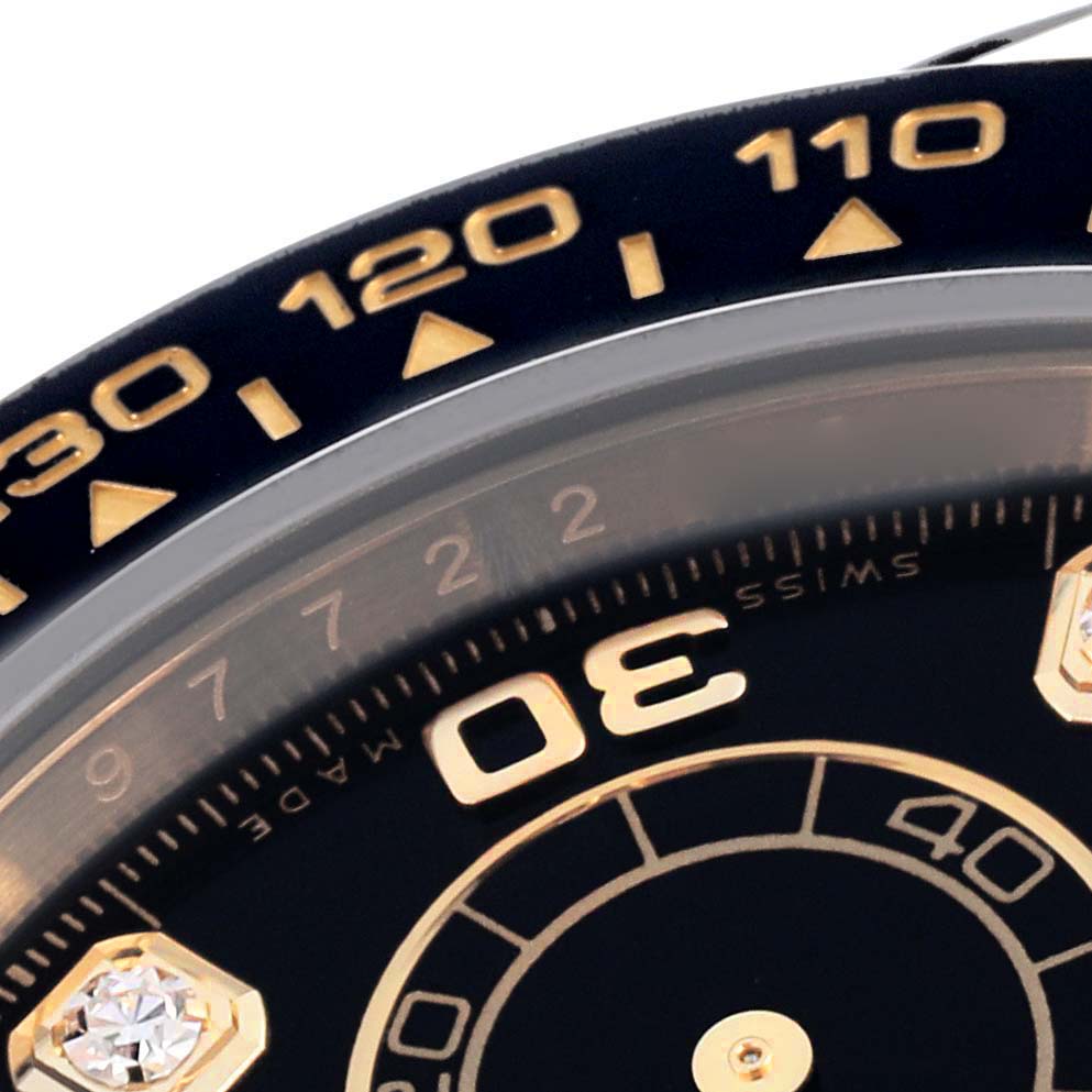 The image shows a close-up of the bezel and dial of a Rolex Daytona 116518 Men's Yellow Gold Black Dial 116518 Men's Yellow Gold Black Dial watch, highlighting the tachymetric scale and part of the face.