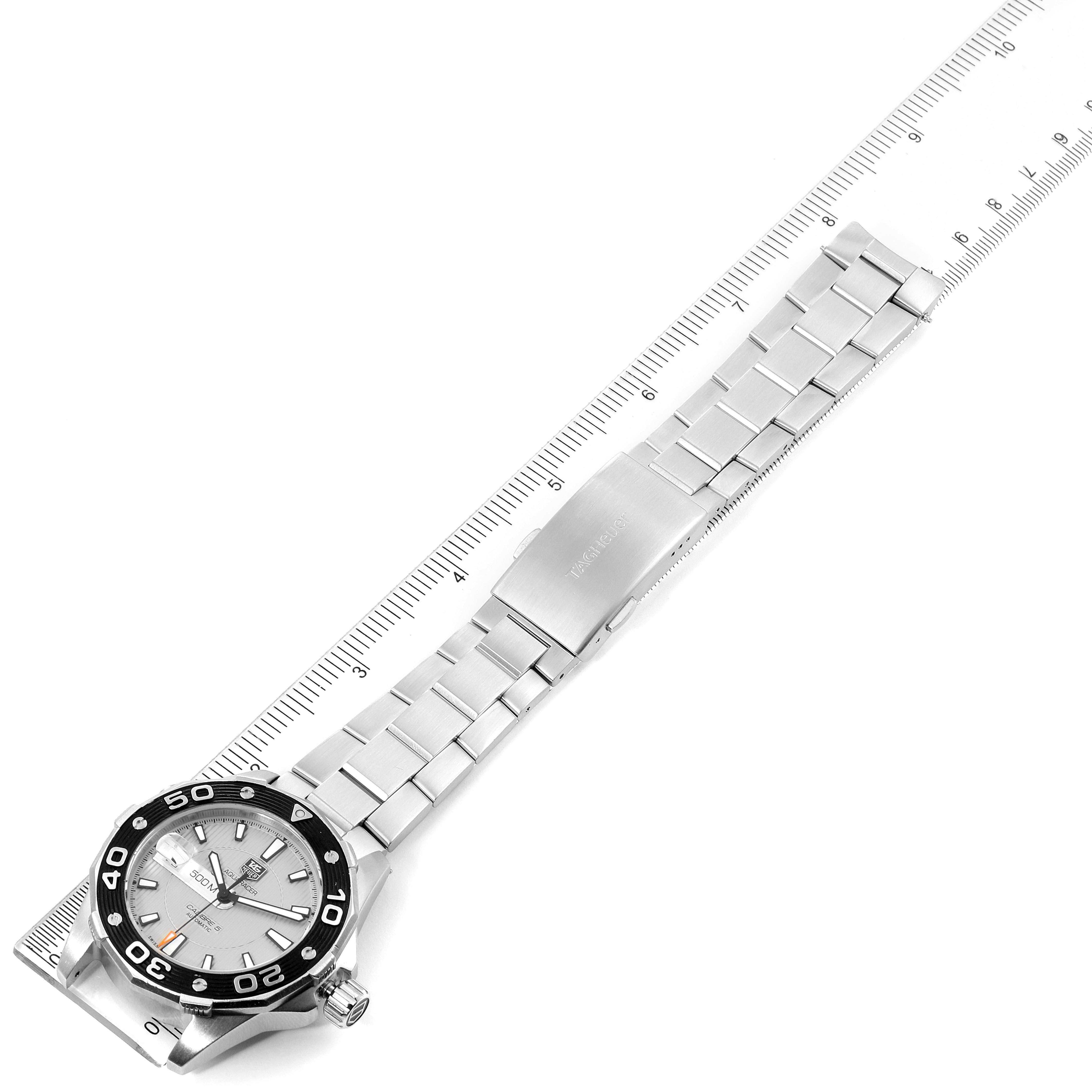 This image shows a Tag Heuer Aquaracer WAJ2111.BA0870 Men's Stainless Steel Grey Dial WAJ2111.BA0870 Men's Stainless Steel Grey Dial watch from an angled top-down perspective with a ruler for scale.