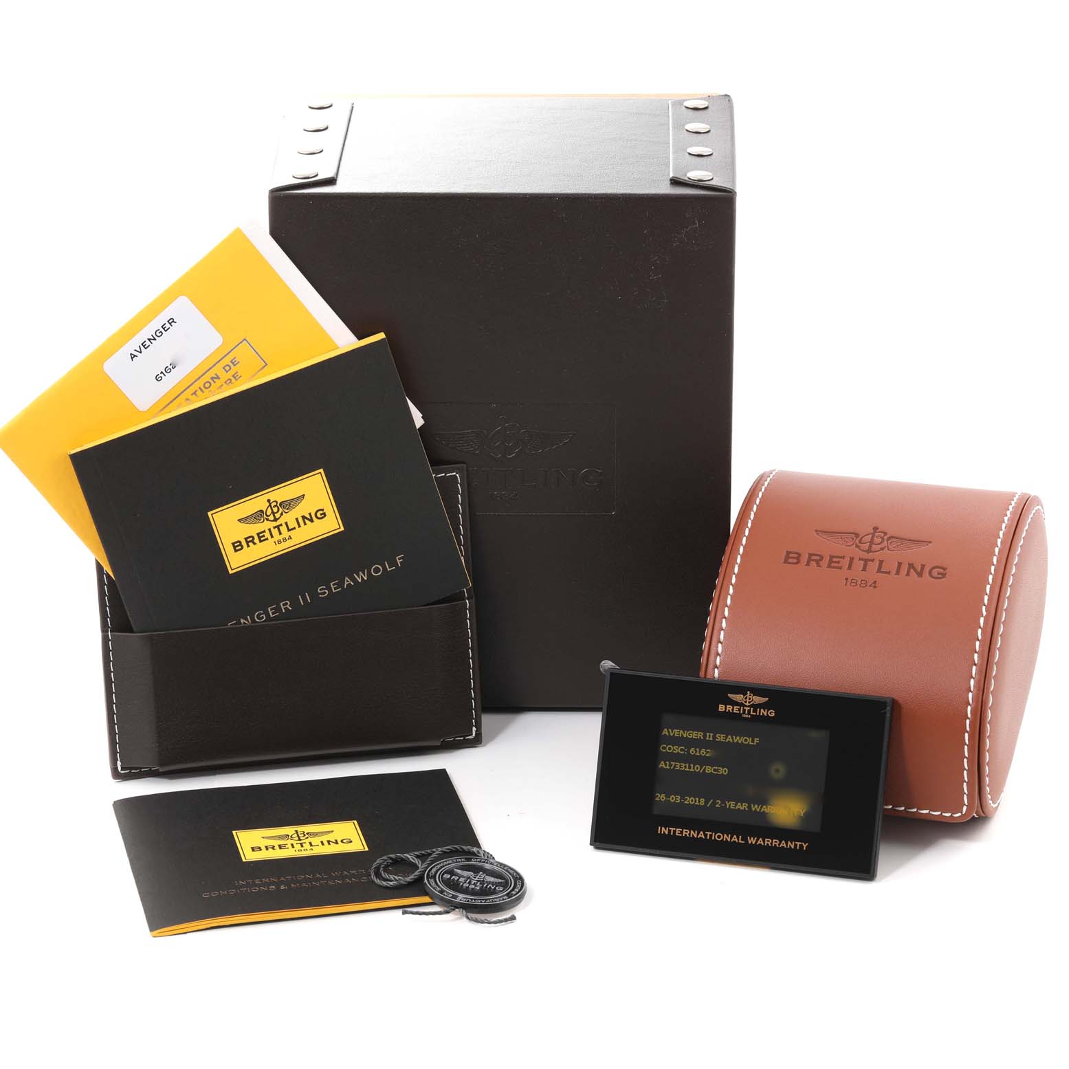 The image shows the packaging and accessories for a Breitling Avenger A17331 Men's Stainless Steel Black Dial A17331 Men's Stainless Steel Black Dial watch, including boxes, manuals, and warranty card.