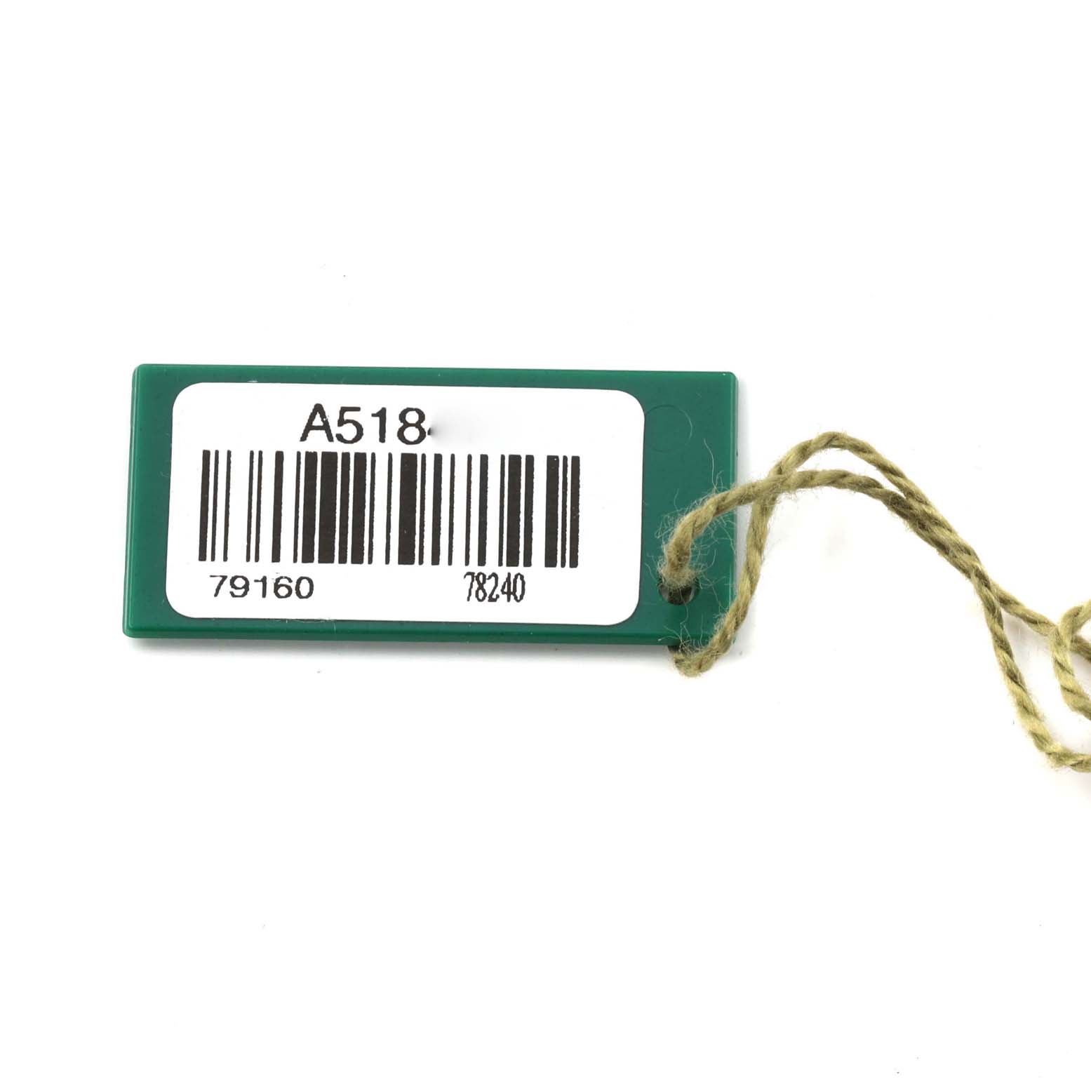 This image shows a green tag with a barcode, string, and model numbers for a Rolex Date 79160 Women's Stainless Steel White Dial 79160 Women's Stainless Steel White Dial watch.
