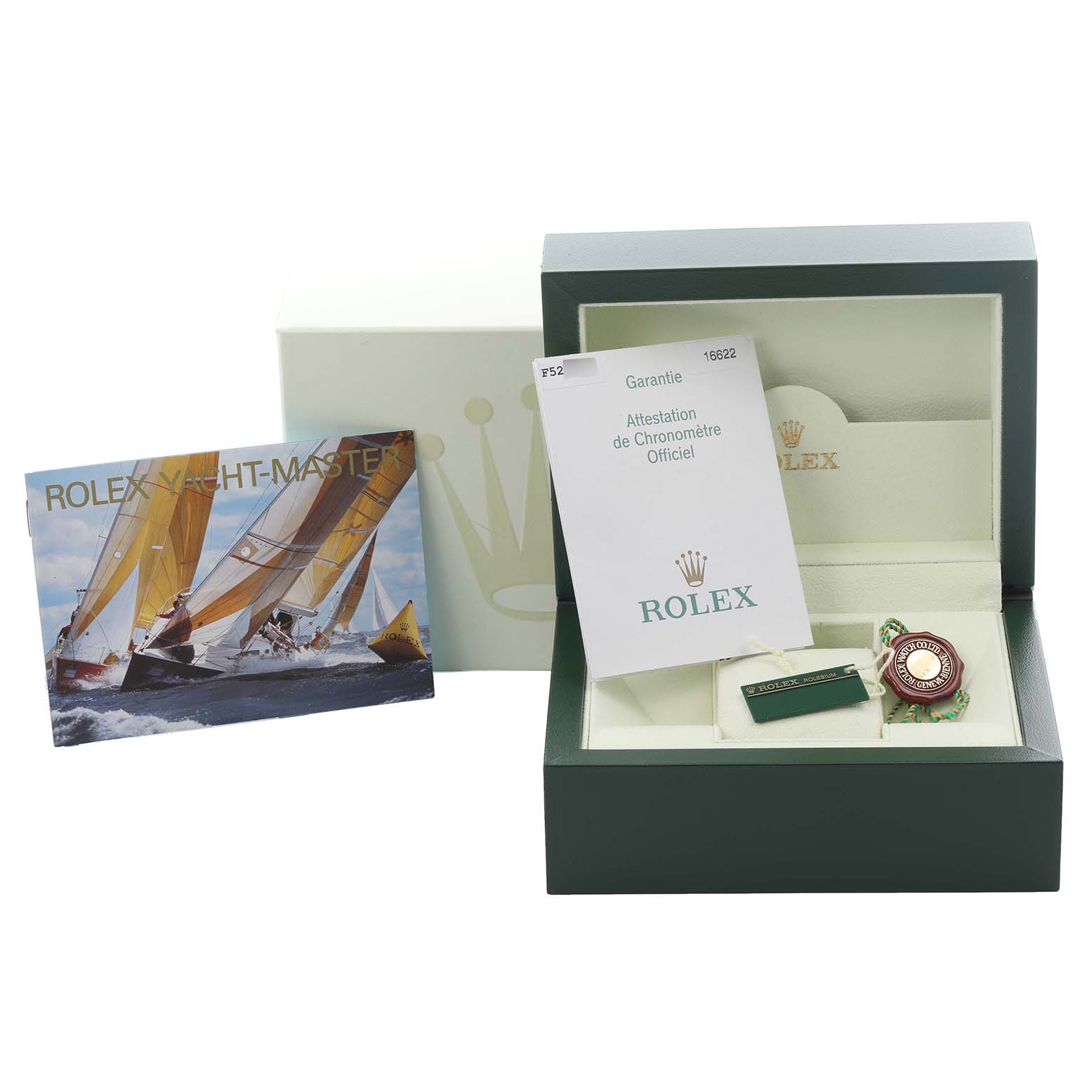 The image shows accessories for the Rolex Yacht-Master 16622 Men's Stainless Steel Silver Dial 16622 Men's Stainless Steel Silver Dial, including the box, warranty card, and tags, from a frontal angle.
