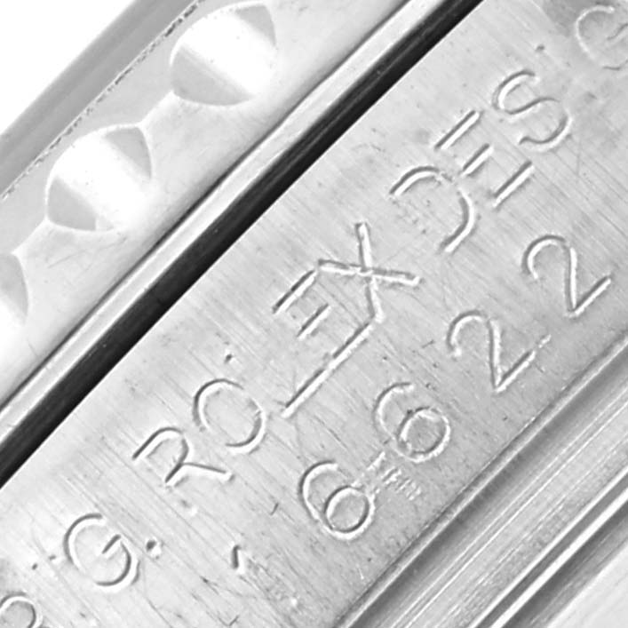 The image shows a close-up view of the engraved edge of a Rolex Yacht-Master 16622 Men's Stainless Steel Silver Dial 16622 Men's Stainless Steel Silver Dial, focusing on the watch's serial and model number.