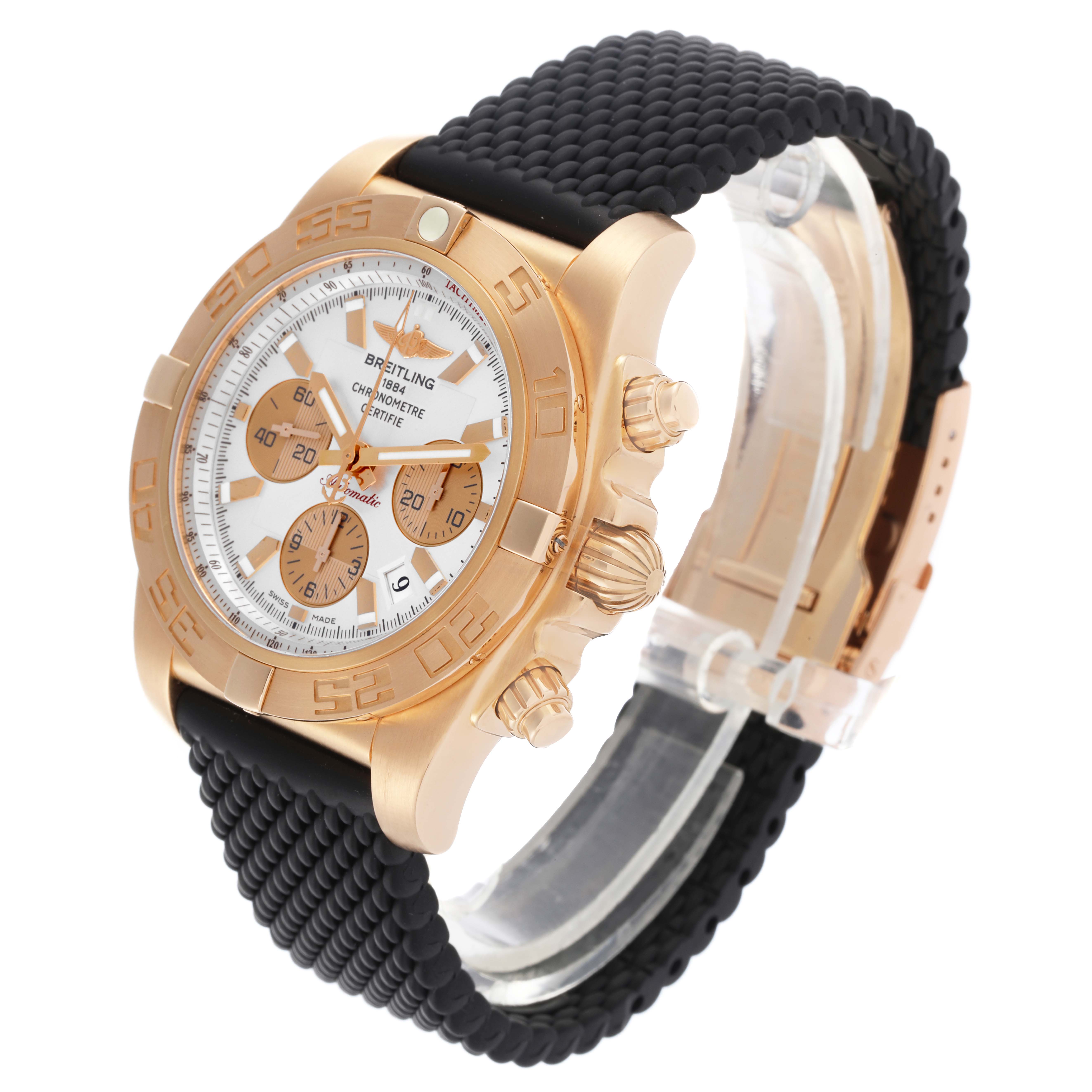 The Breitling Chronomat HB0110 Men's Rose Gold Silver Dial HB0110 Men's Rose Gold Silver Dial watch is shown at a side angle, displaying its rose gold case, dial, crown, and black strap.