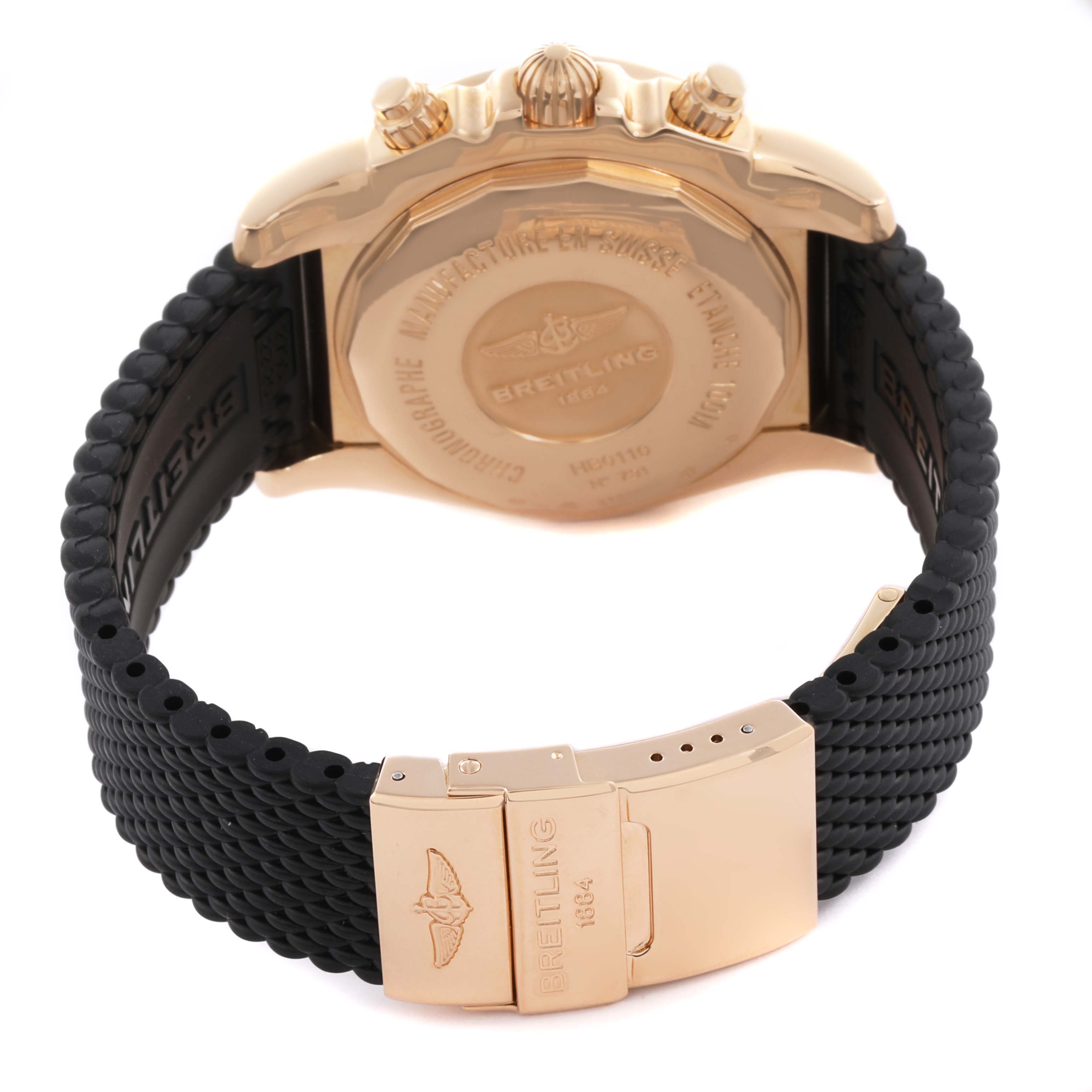 The image shows the back and clasp of the Breitling Chronomat HB0110 Men's Rose Gold Silver Dial HB0110 Men's Rose Gold Silver Dial watch, highlighting the case back and black strap.