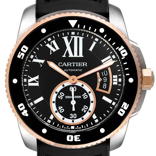 The image shows a close-up, front view of the Calibre de Cartier watch by Cartier, featuring its black dial, bezel, and date display.