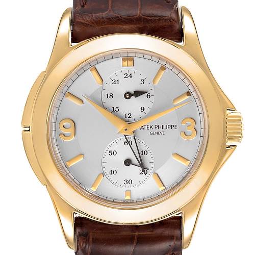 The image shows a frontal view of the Patek Philippe Calatrava 5134J Men's Yellow Gold White Dial 5134J Men's Yellow Gold White Dial watch, highlighting its dial, hands, subdials, and leather strap.