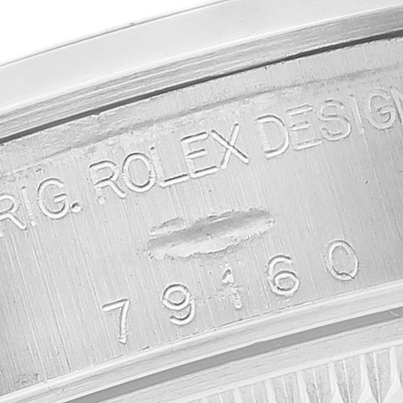 The image shows the inner bezel with the serial and model number of a Rolex Date 79160 Women's Stainless Steel White Dial 79160 Women's Stainless Steel White Dial model watch.