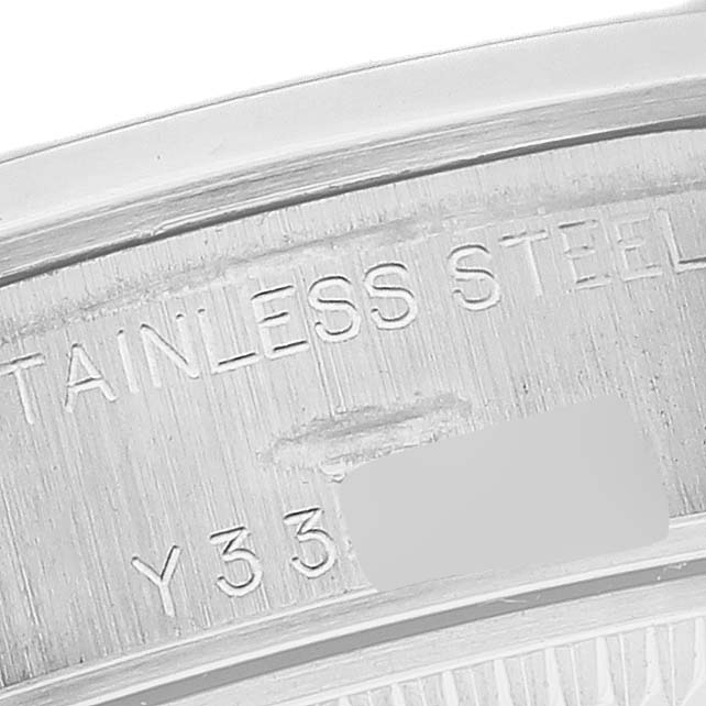 This image shows a close-up of the inner caseback edge, displaying the serial number and "STAINLESS STEEL" text of a Rolex Date 79160 Women's Stainless Steel White Dial 79160 Women's Stainless Steel White Dial model watch.